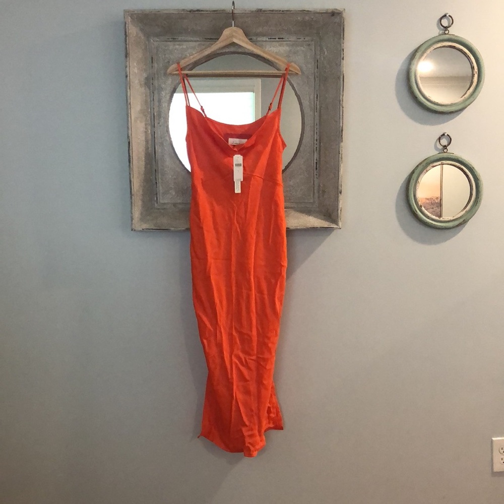 New with tags, never worn gorgeous maxi with some stretch and 12 in slits.